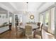 Elegant dining room with a tray ceiling, hardwood floors, and stylish furnishings at 5655 Mccoy Rd Nw, Acworth, GA 30101