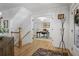 Inviting foyer with hardwood floors, elegant lighting, and an open staircase at 5655 Mccoy Rd Nw, Acworth, GA 30101