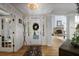 Bright foyer with hardwood floors, stylish lighting, and a view into the living area at 5655 Mccoy Rd Nw, Acworth, GA 30101