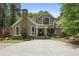 Charming two-story home with stone accents, a welcoming front porch, and a spacious driveway at 5655 Mccoy Rd Nw, Acworth, GA 30101