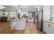 Open concept kitchen with stainless steel appliances, island, and dining area at 5655 Mccoy Rd Nw, Acworth, GA 30101