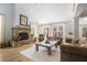 Spacious living room with a stone fireplace, vaulted ceilings, and large windows at 5655 Mccoy Rd Nw, Acworth, GA 30101