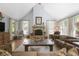 Cozy living room with a stone fireplace, comfortable seating, and natural light at 5655 Mccoy Rd Nw, Acworth, GA 30101