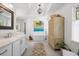 Bright main bathroom with soaking tub, marble countertops, and custom cabinetry at 5655 Mccoy Rd Nw, Acworth, GA 30101