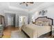 Tranquil main bedroom with hardwood floors and easy access to ensuite bathroom at 5655 Mccoy Rd Nw, Acworth, GA 30101