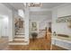 Elegant staircase with detailed wood trim and wrought iron banister at 5655 Mccoy Rd Nw, Acworth, GA 30101