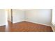 Bright bedroom with hardwood floors, neutral paint, and ample natural light from the large window at 11050 Skyway Dr, Duluth, GA 30097