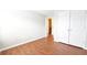 Bedroom featuring wood-look floors and a spacious closet for storage at 11050 Skyway Dr, Duluth, GA 30097