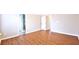 Bright bedroom with wood-look flooring and neutral paint, creating a move-in-ready space at 11050 Skyway Dr, Duluth, GA 30097