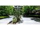 Gated community entrance surrounded by lush greenery, providing security and a serene welcome at 11050 Skyway Dr, Duluth, GA 30097