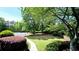 Well-maintained green space with manicured lawns and mature trees creating a park-like setting at 11050 Skyway Dr, Duluth, GA 30097