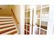 Living room area with french doors and staircase at 11050 Skyway Dr, Duluth, GA 30097