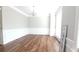 A bright living room featuring hardwood floors, modern wainscotting, and a stylish chandelier at 11050 Skyway Dr, Duluth, GA 30097