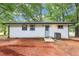 The backyard features the exterior and a concrete patio at 2457 Shiloh Dr, Decatur, GA 30034