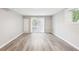 Finished basement with durable grey flooring and sliding glass doors leading to the backyard at 2457 Shiloh Dr, Decatur, GA 30034
