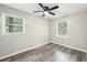 Bedroom with two windows providing ample natural light and gray floors at 2457 Shiloh Dr, Decatur, GA 30034