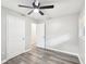 Bright bedroom with gray flooring, a ceiling fan and two closets for ample storage at 2457 Shiloh Dr, Decatur, GA 30034