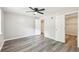 Bedroom with hardwood floors, neutral paint, a ceiling fan, and a walk-in closet at 2457 Shiloh Dr, Decatur, GA 30034