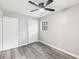 Cozy bedroom features a window, ceiling fan, and gray flooring at 2457 Shiloh Dr, Decatur, GA 30034