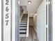 Inviting entryway featuring modern flooring and a staircase with updated railings at 2457 Shiloh Dr, Decatur, GA 30034