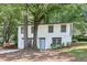 Charming two-story home nestled between mature trees and lush greenery at 2457 Shiloh Dr, Decatur, GA 30034