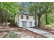 Spacious two-story home with lush greenery, nestled amongst mature trees at 2457 Shiloh Dr, Decatur, GA 30034