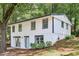 Charming two-story home with white siding, gray trim, and well-manicured landscaping at 2457 Shiloh Dr, Decatur, GA 30034