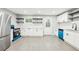 Updated kitchen has white cabinets, stainless appliances, and modern shelving at 2457 Shiloh Dr, Decatur, GA 30034