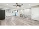 Open concept with grey flooring, and modern white kitchen with stainless steel appliances at 2457 Shiloh Dr, Decatur, GA 30034