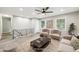 Bright living room boasts updated ceiling fan and neutral finishes at 2457 Shiloh Dr, Decatur, GA 30034