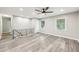 Bright living room with gray flooring, recessed lighting, and modern ceiling fan at 2457 Shiloh Dr, Decatur, GA 30034