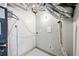 Utility room with new mechanicals, storage and painted flooring at 2457 Shiloh Dr, Decatur, GA 30034
