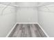 Walk-in closet featuring wire shelving and hardwood floors at 2457 Shiloh Dr, Decatur, GA 30034