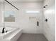 The primary bathroom features a soaking tub and glass enclosed shower with hexagon tile at 3244 Lions Ruby Ln, Atlanta, GA 30349