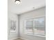 This bedroom features plush carpeting, two windows that bring in natural light, and a ceiling light at 3244 Lions Ruby Ln, Atlanta, GA 30349