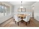 Elegant dining room boasting a round table, chandelier, and wainscoting at 3244 Lions Ruby Ln, Atlanta, GA 30349