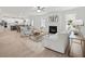 Cozy living room with fireplace, modern furniture, and open floor plan into the kitchen and dining area at 3244 Lions Ruby Ln, Atlanta, GA 30349
