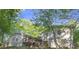 Large backyard with patio and wooded view at 3300 Old Mill Ct, Decatur, GA 30033