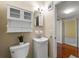 Bathroom featuring white vanity, toilet, and hardwood floors at 3300 Old Mill Ct, Decatur, GA 30033