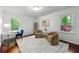 Bright and airy bedroom with hardwood floors and tranquil views of the surrounding nature at 3300 Old Mill Ct, Decatur, GA 30033