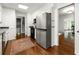 Bright eat-in kitchen with stainless steel appliances, hardwood floors, and access to dining area at 3300 Old Mill Ct, Decatur, GA 30033