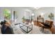 Bright living room featuring hardwood floors, neutral furniture, and natural light at 3300 Old Mill Ct, Decatur, GA 30033