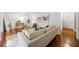 Bright living room with hardwood floors, neutral paint, modern decor, and large arched mirror at 3300 Old Mill Ct, Decatur, GA 30033