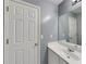 Neutral bathroom with single vanity and mirror on the wall at 4603 Parkway Circle, Atlanta, GA 30349