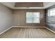Spacious bedroom with a tray ceiling, light-colored carpet, and an accent wall at 4603 Parkway Circle, Atlanta, GA 30349