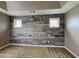 Large bedroom featuring a stylish accent wall and windows for natural light at 4603 Parkway Circle, Atlanta, GA 30349