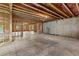 Spacious unfinished basement with exposed ceiling and wooden support structure at 6132 Hutchins Dr, Buford, GA 30518