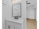 Modern bathroom featuring a white vanity and black accents at 6132 Hutchins Dr, Buford, GA 30518