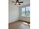 This bedroom has a ceiling fan, hardwood flooring and a window with a view of the outdoors at 6132 Hutchins Dr, Buford, GA 30518