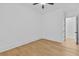 Empty bedroom with hardwood flooring and bright white walls at 6132 Hutchins Dr, Buford, GA 30518